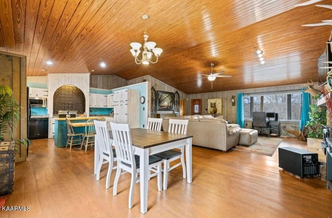 2122 Northwest Old River Road Charleston, TN 37310 - Photo 6 of 28 a living room with furniture a dining table and chairs with wooden floor
