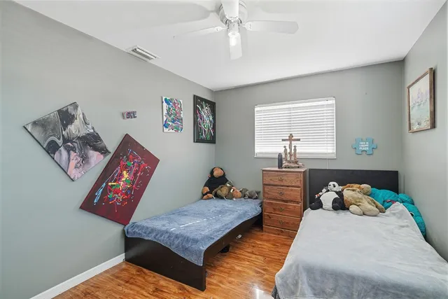 a bedroom with bed and a window