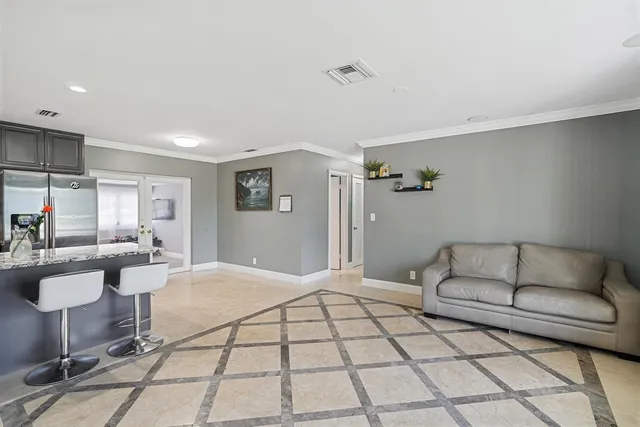 a living room with furniture and a rug