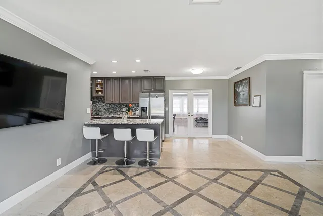 a kitchen with a table and chairs in it