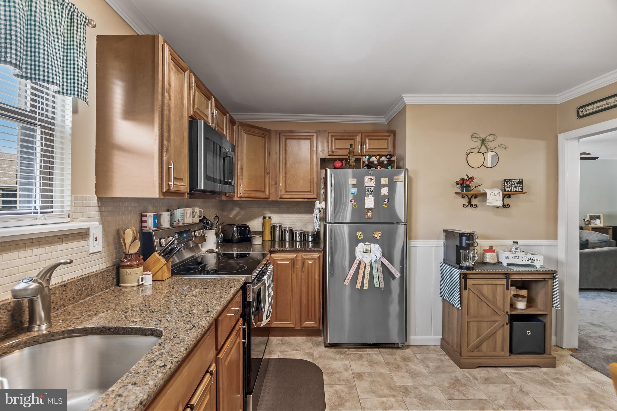 1475 Mt Holly Road, Unit L2 Beverly, NJ 08010 - Photo 11 of 28 a kitchen with stainless steel appliances granite countertop a sink stove and refrigerator