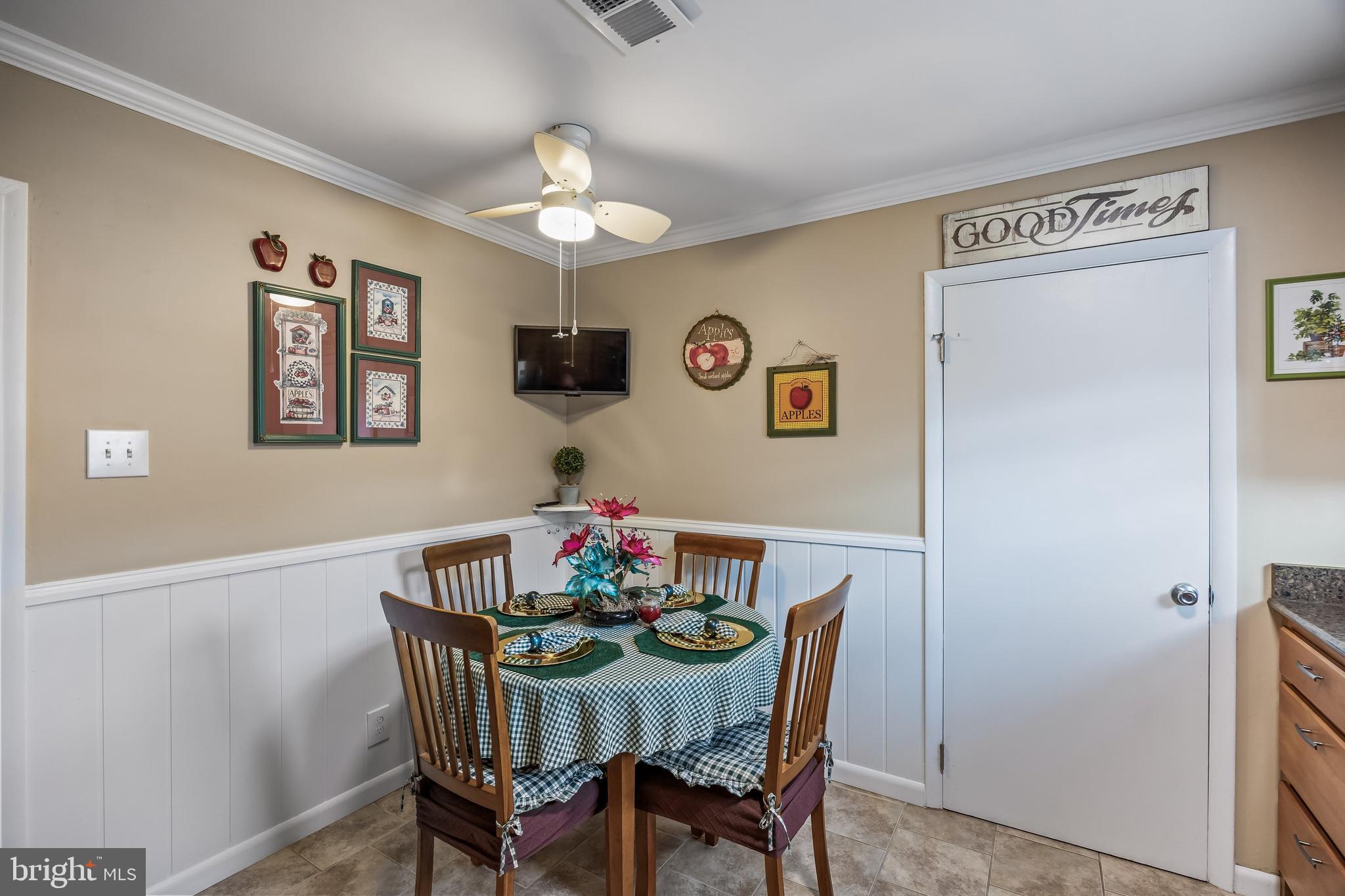 1475 Mt Holly Road, Unit L2 Beverly, NJ 08010 - Photo 12 of 28 a view of a dining room with furniture and chandelier