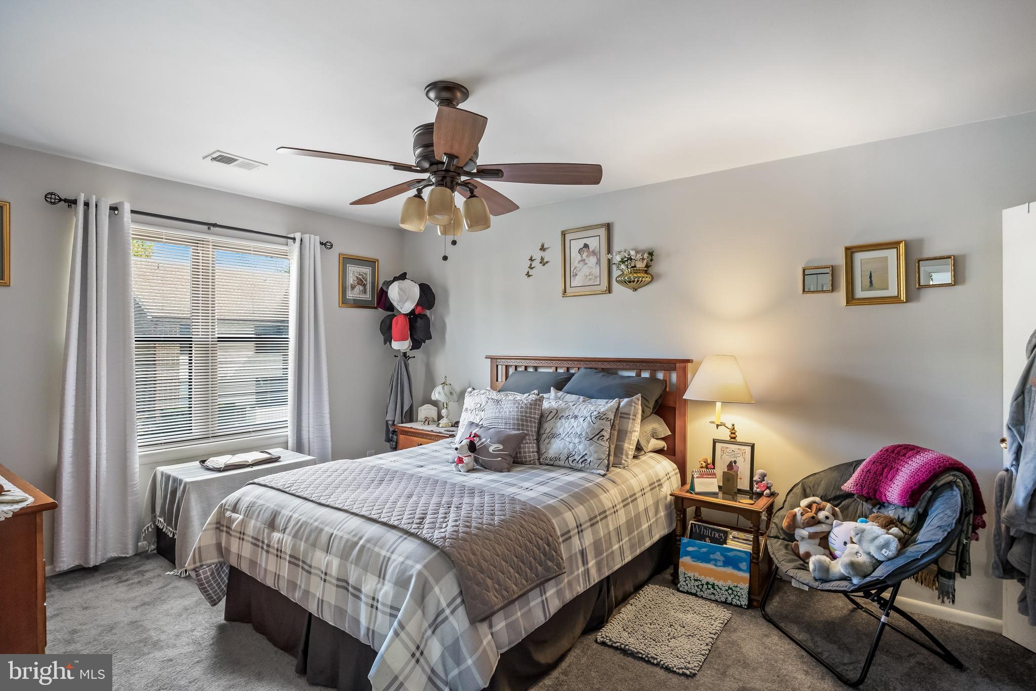 1475 Mt Holly Road, Unit L2 Beverly, NJ 08010 - Photo 13 of 28 a bedroom with a bed a dresser and a chandelier