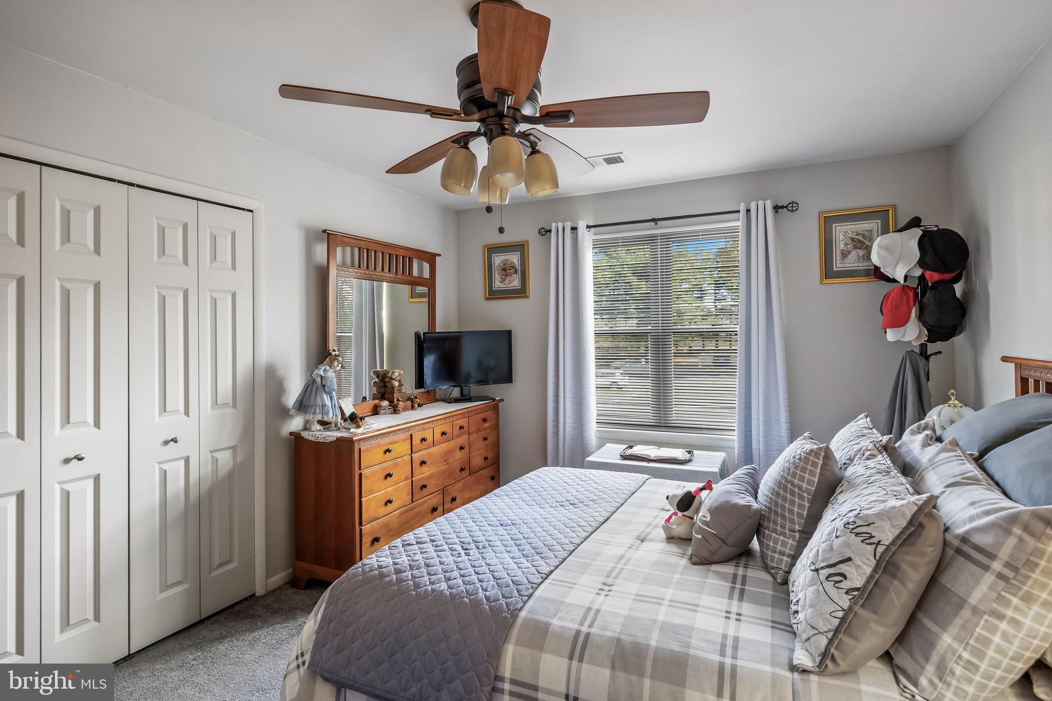 1475 Mt Holly Road, Unit L2 Beverly, NJ 08010 - Photo 14 of 28 a bedroom with a bed and a chandelier