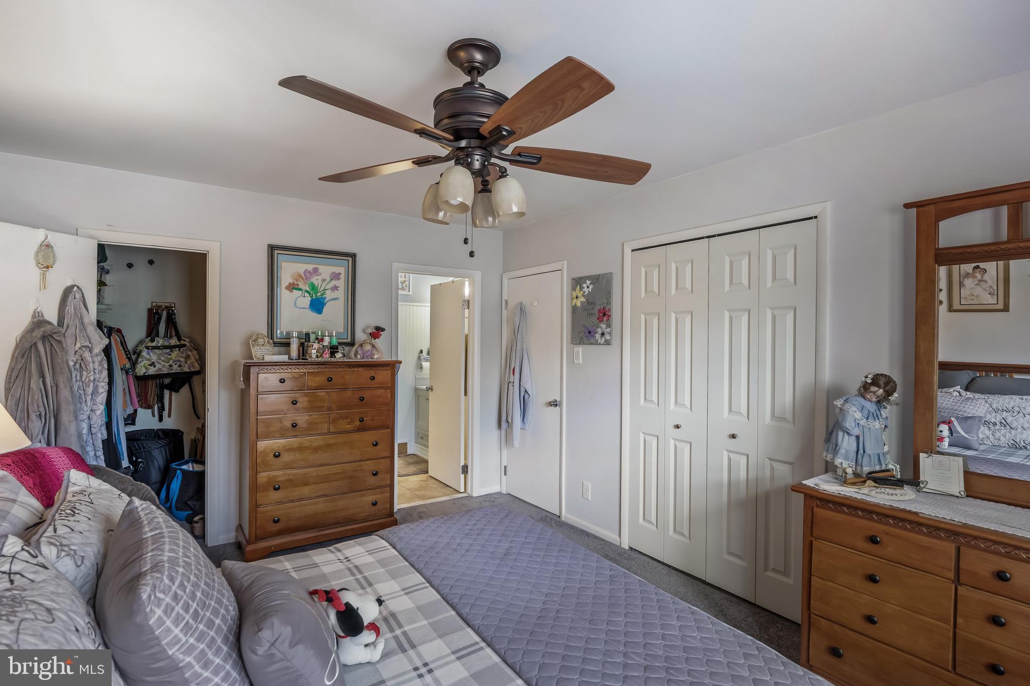 1475 Mt Holly Road, Unit L2 Beverly, NJ 08010 - Photo 15 of 28 a bedroom with a bed and a chandelier