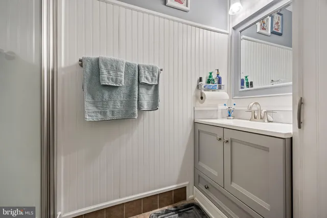 a bathroom with a sink and mirror
