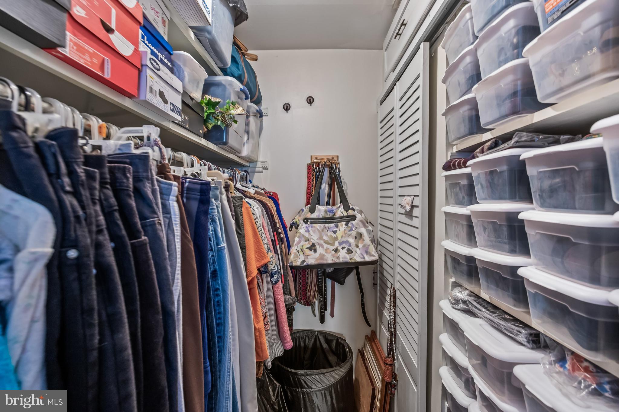 1475 Mt Holly Road, Unit L2 Beverly, NJ 08010 - Photo 18 of 28 a view of walk in closet with clothes and shoes