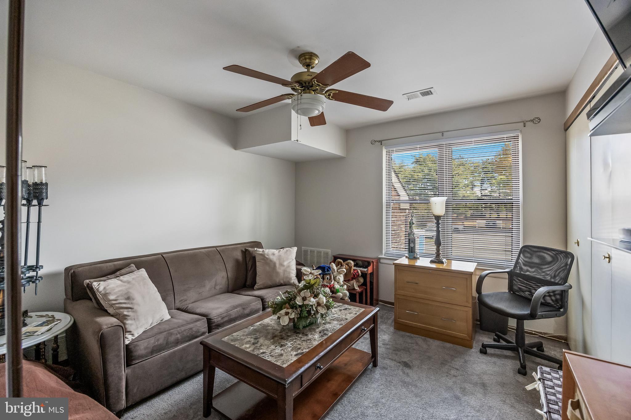 1475 Mt Holly Road, Unit L2 Beverly, NJ 08010 - Photo 19 of 28 a living room with furniture ceiling fan and a window
