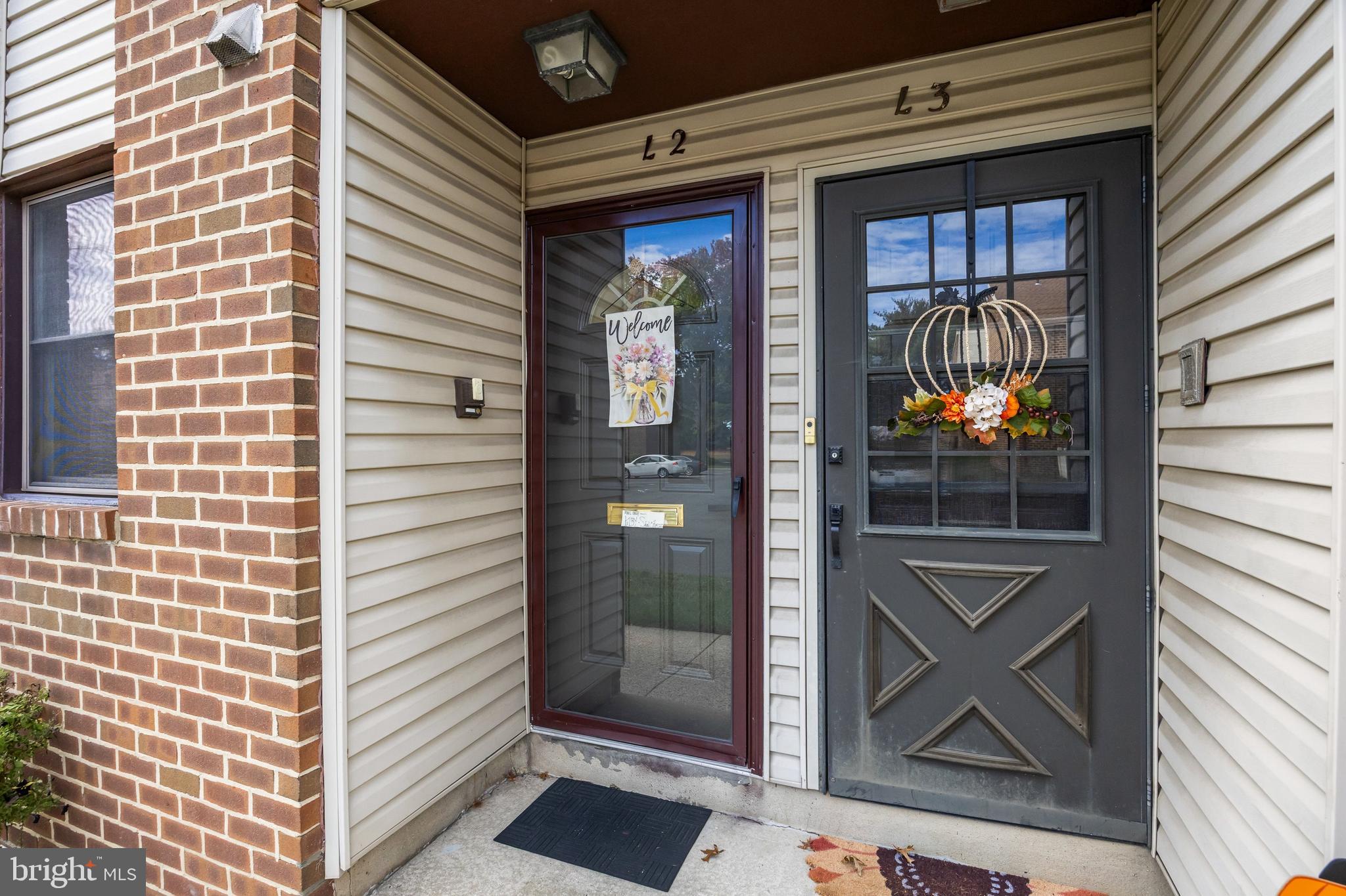 1475 Mt Holly Road, Unit L2 Beverly, NJ 08010 - Photo 2 of 28 a view of front door of house and living room