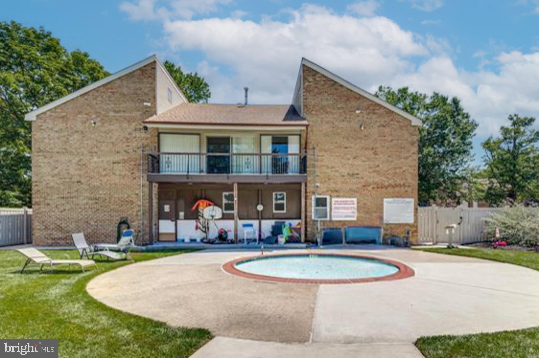 1475 Mt Holly Road, Unit L2 Beverly, NJ 08010 - Photo 25 of 28 a view of a house with swimming pool and a yard