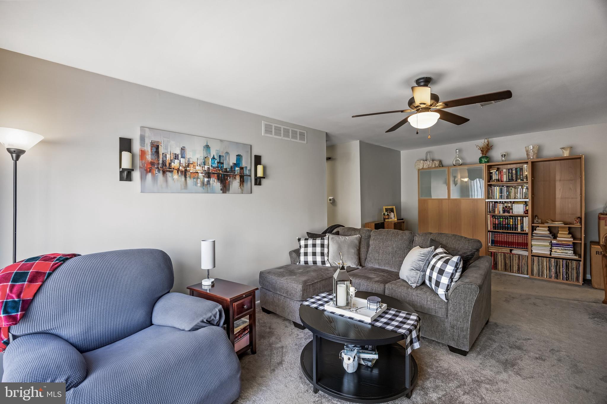 1475 Mt Holly Road, Unit L2 Beverly, NJ 08010 - Photo 6 of 28 a living room with furniture a couch and a bookshelf