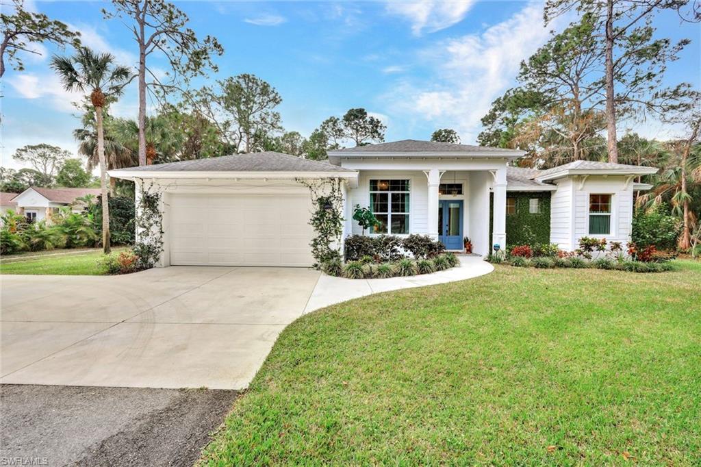 a view of a house with backyard sitting area and garden
