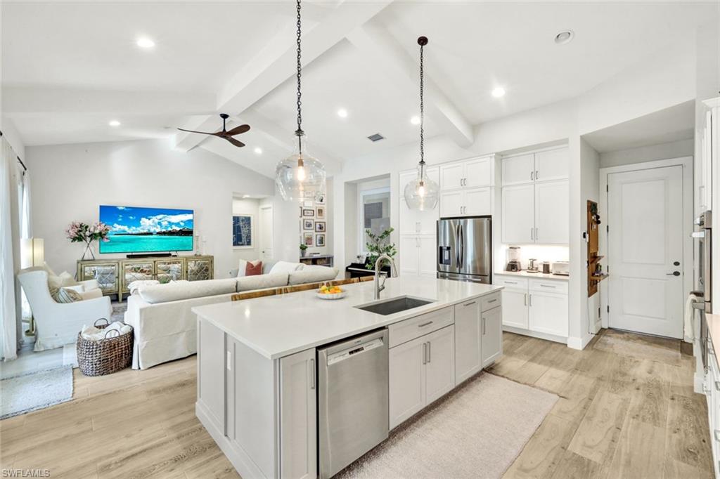 3700 11th Avenue Southwest Naples, FL 34117 - Photo 49 of 50 a kitchen with white cabinets and white appliances