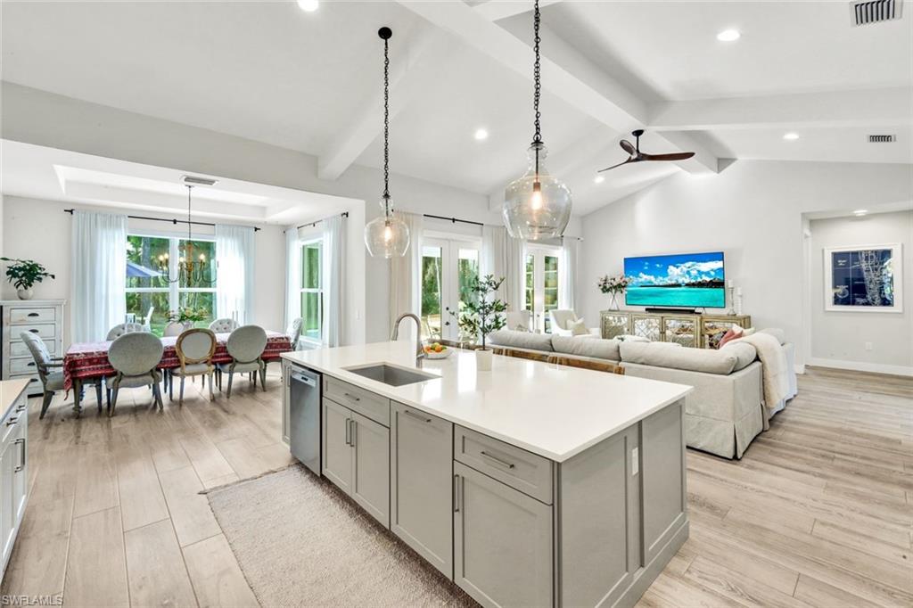 3700 11th Avenue Southwest Naples, FL 34117 - Photo 50 of 50 a large kitchen with kitchen island a large island in it