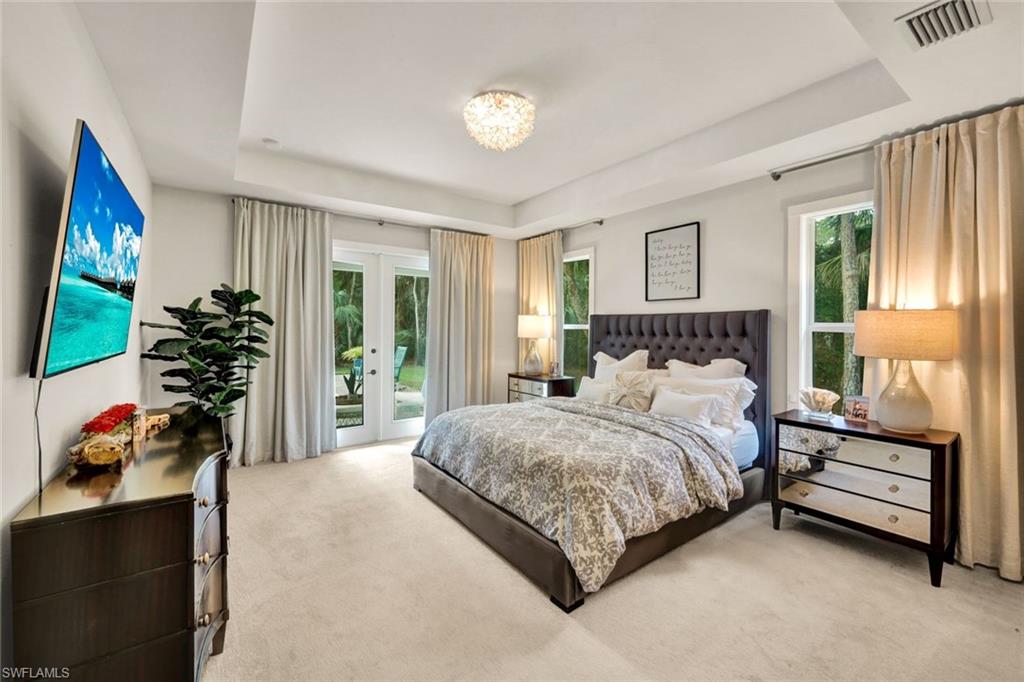 3700 11th Avenue Southwest Naples, FL 34117 - Photo 13 of 50 a bedroom with a bed and a window