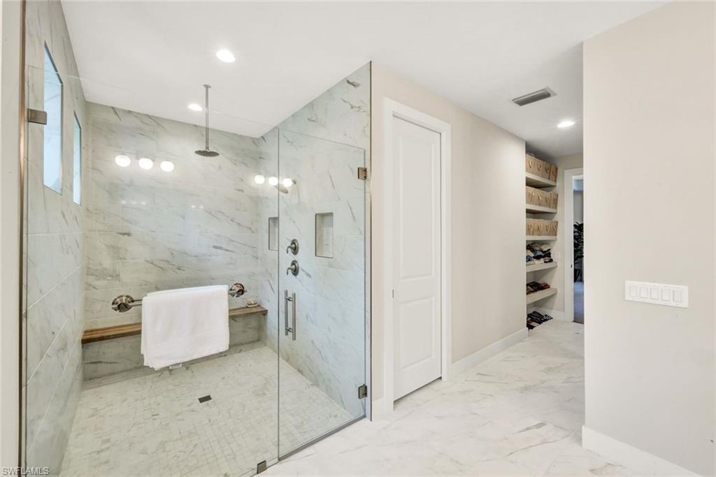 3700 11th Avenue Southwest Naples, FL 34117 - Photo 16 of 50 a bathroom with a shower and a sink