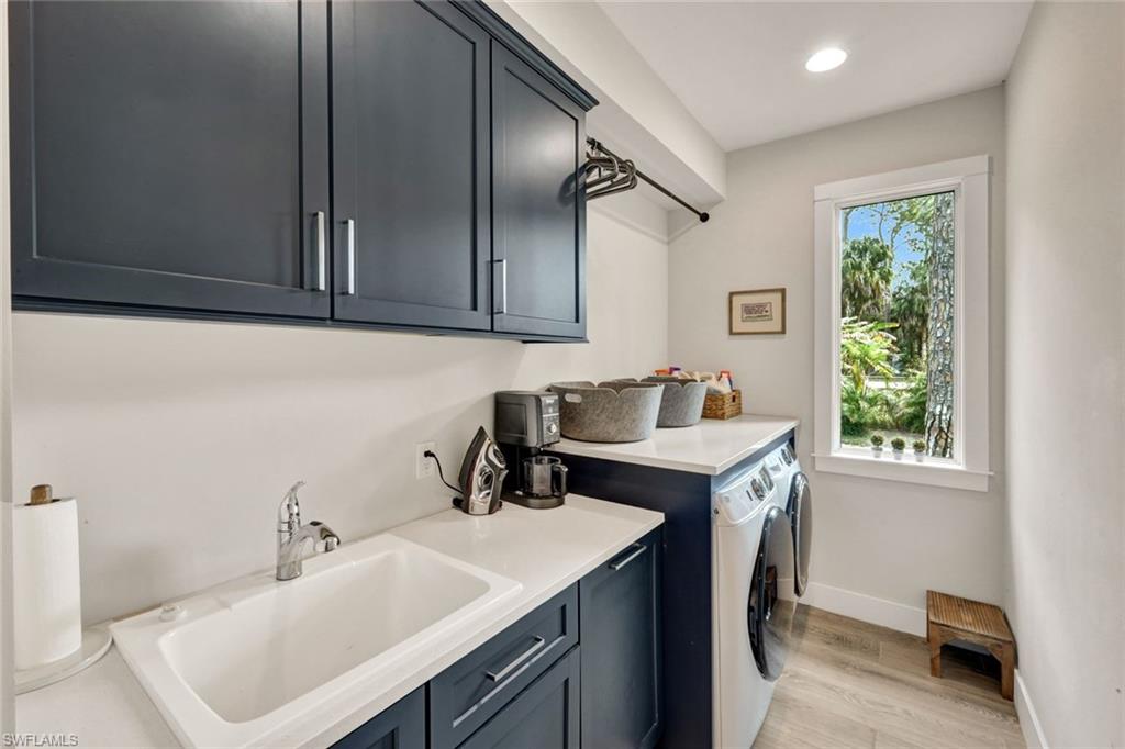 3700 11th Avenue Southwest Naples, FL 34117 - Photo 22 of 50 a kitchen with a sink cabinets and a window