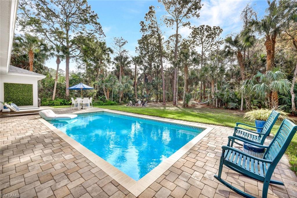 3700 11th Avenue Southwest Naples, FL 34117 - Photo 25 of 50 a view of swimming pool with chairs