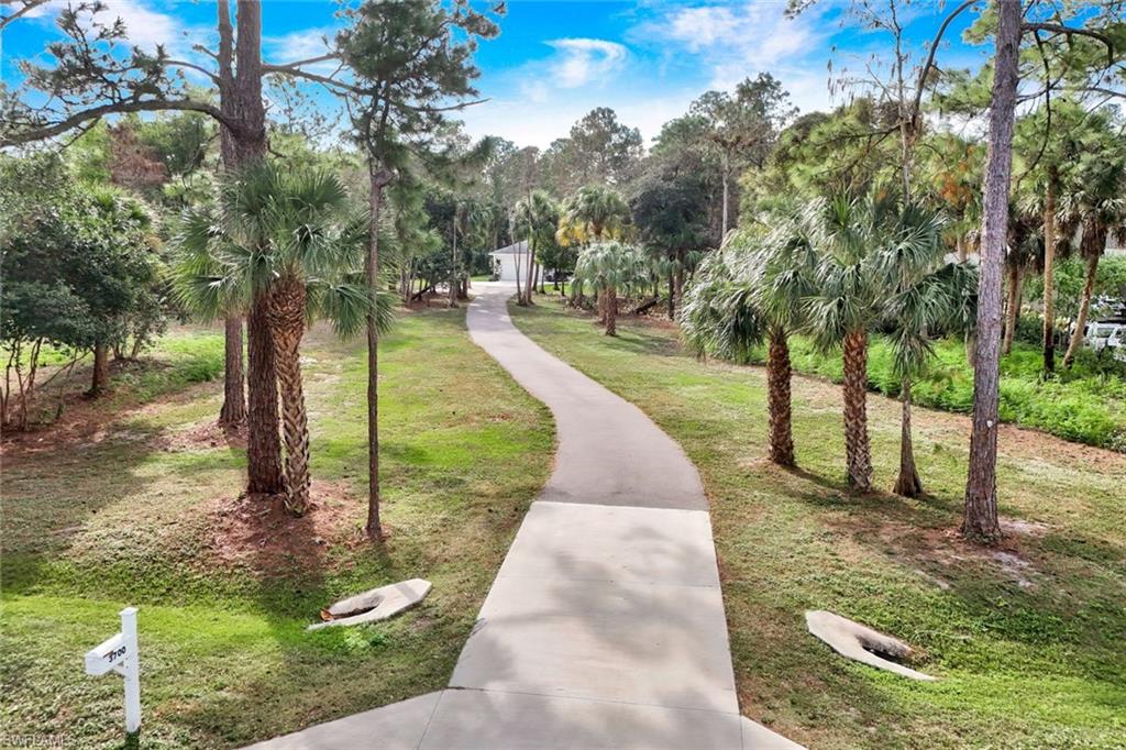 3700 11th Avenue Southwest Naples, FL 34117 - Photo 4 of 50 a park view with a fountain