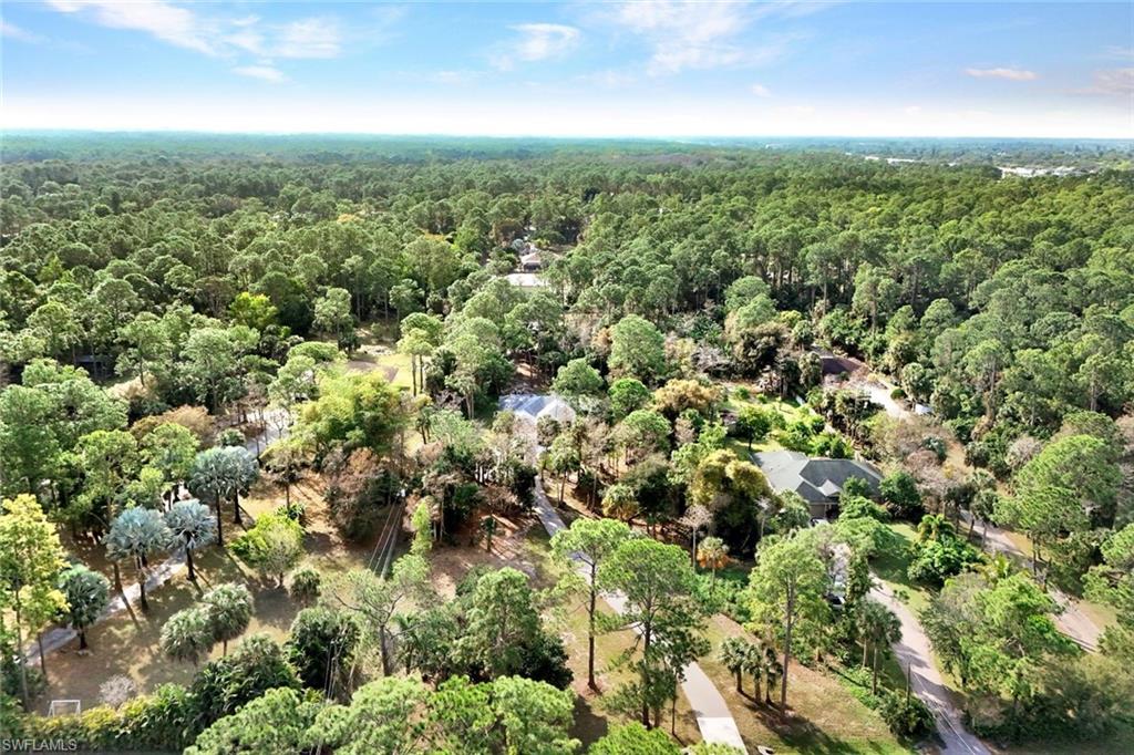 3700 11th Avenue Southwest Naples, FL 34117 - Photo 44 of 50 an aerial view of residential houses with outdoor space and trees