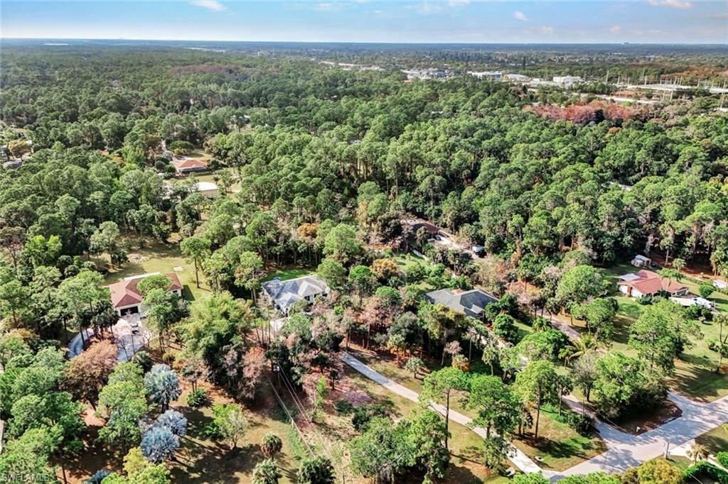 3700 11th Avenue Southwest Naples, FL 34117 - Photo 45 of 50 a view of a city with lush green forest