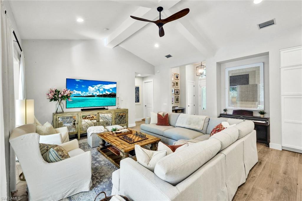 3700 11th Avenue Southwest Naples, FL 34117 - Photo 7 of 50 a living room with furniture and a flat screen tv
