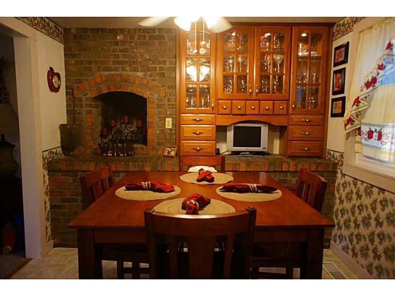 134 Crosslands Road Butler, PA 16002 - Photo 8 of 25 Kitchen. wood burning fireplace in kitchen area.