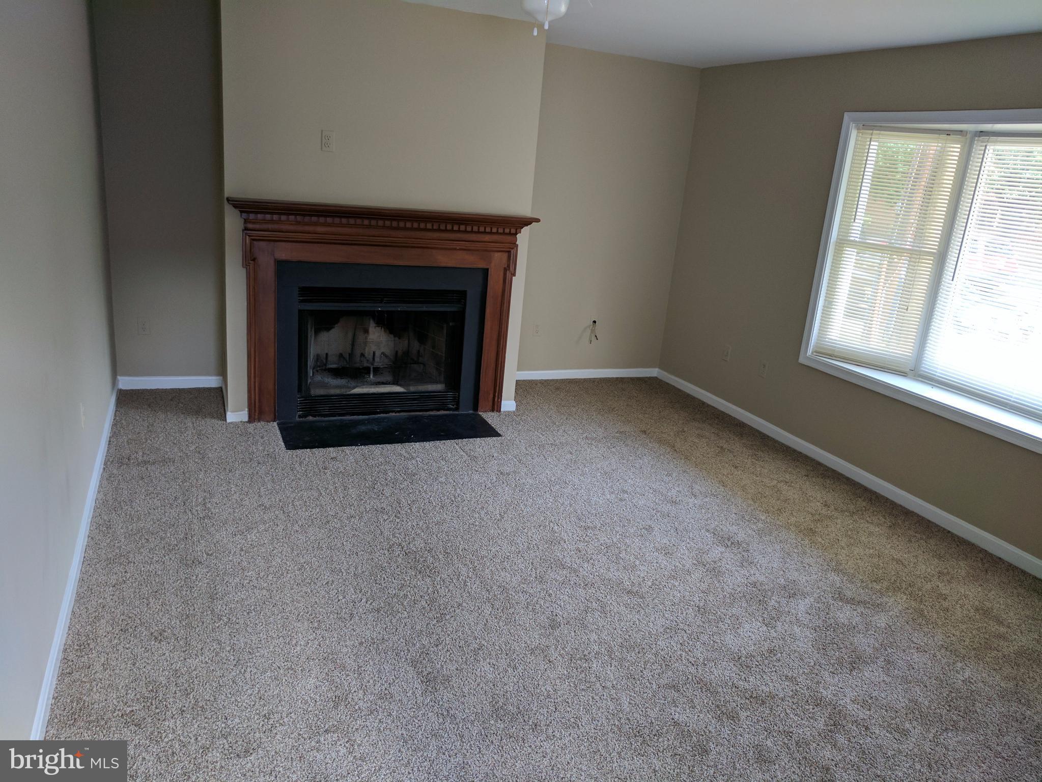 5110 Berwyn Road College Park, MD 20740 - Photo 11 of 28 an empty room with a fireplace
