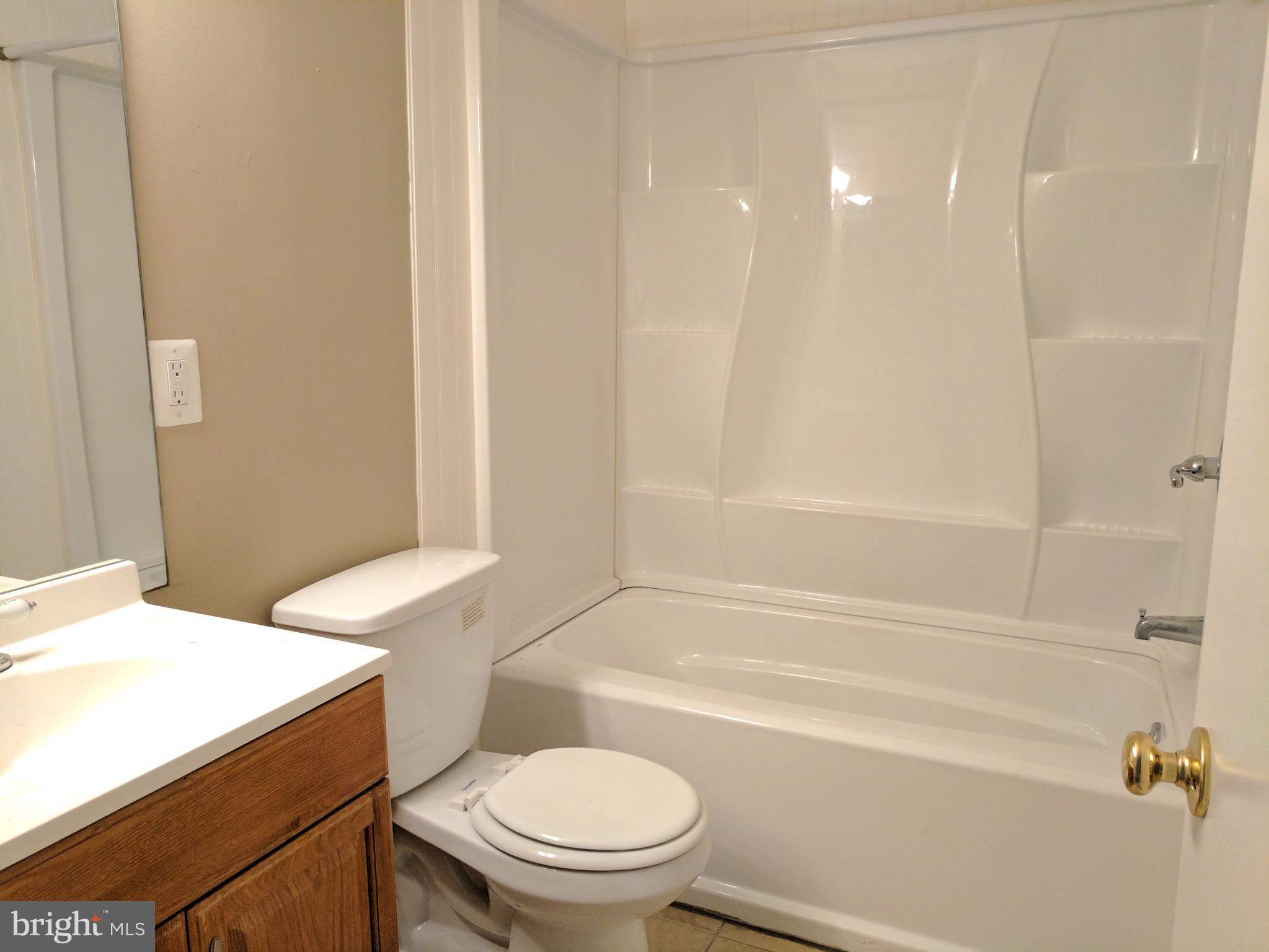 5110 Berwyn Road College Park, MD 20740 - Photo 18 of 28 a bathroom with a sink a toilet and shower