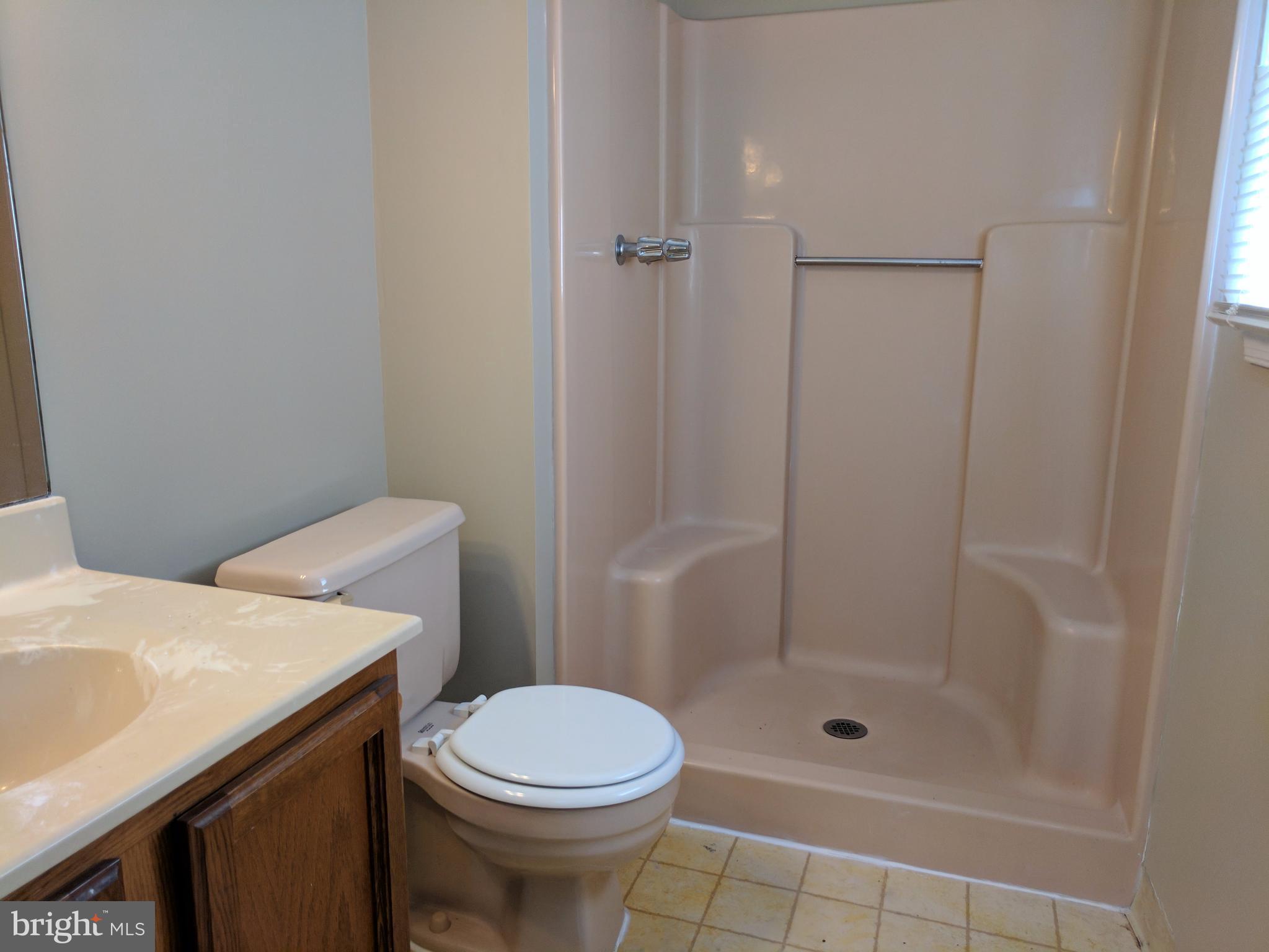 5110 Berwyn Road College Park, MD 20740 - Photo 20 of 28 a bathroom with a sink a toilet and shower