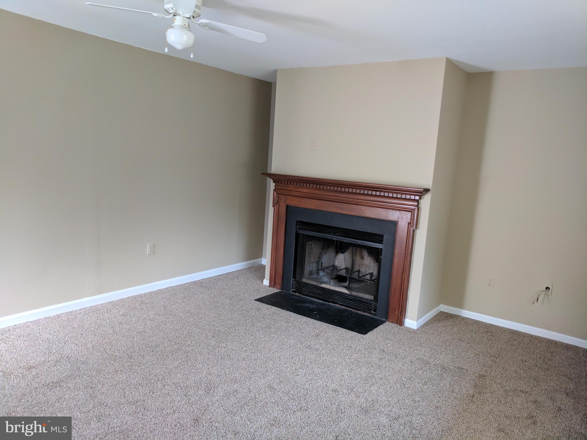 5110 Berwyn Road College Park, MD 20740 - Photo 10 of 28 a living room with a fireplace