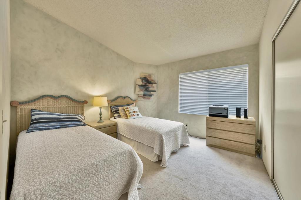 55384 Laurel La Quinta, CA 92253 - Photo 17 of 32 a bedroom with two beds and painted walls