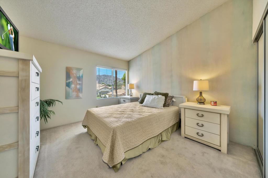 55384 Laurel La Quinta, CA 92253 - Photo 19 of 32 a bedroom with a bed and a dresser