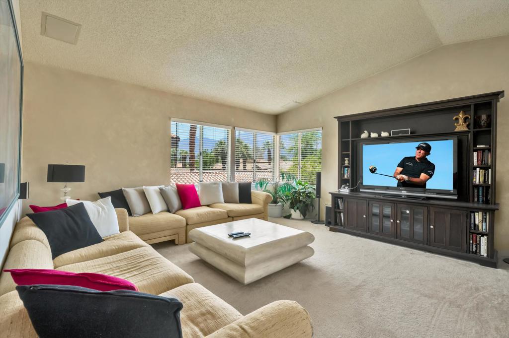55384 Laurel La Quinta, CA 92253 - Photo 22 of 32 a living room with furniture and a flat screen tv