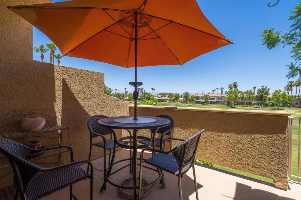 55384 Laurel La Quinta, CA 92253 - Photo 28 of 32 a view of a terrace with furniture and umbrella