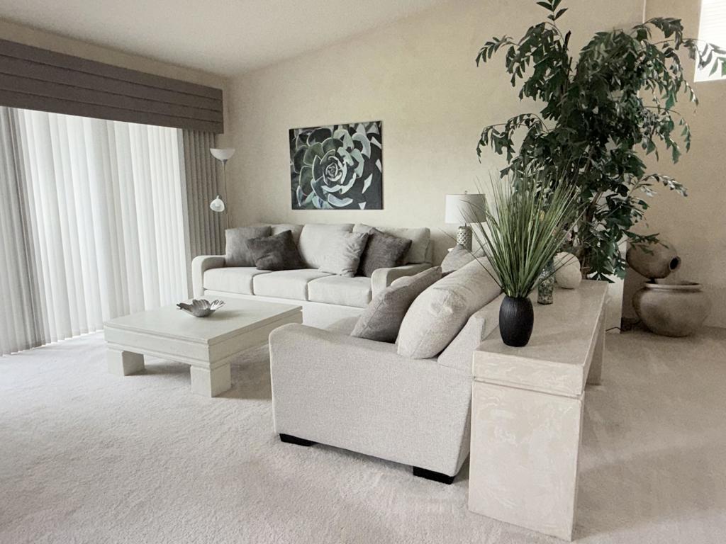 55384 Laurel La Quinta, CA 92253 - Photo 10 of 32 a living room with furniture and a potted plant