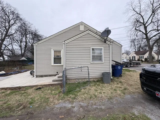 a view of a house with backyard and snow