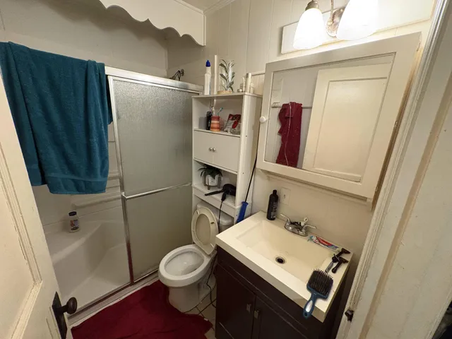 a utility room with sink dryer and washer