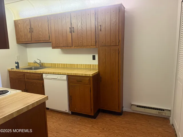 a utility room with sink dryer and washer