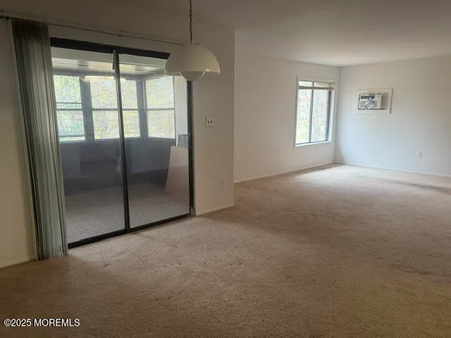 a view of empty room with windows