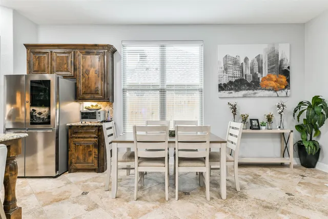 a dining room with furniture and window