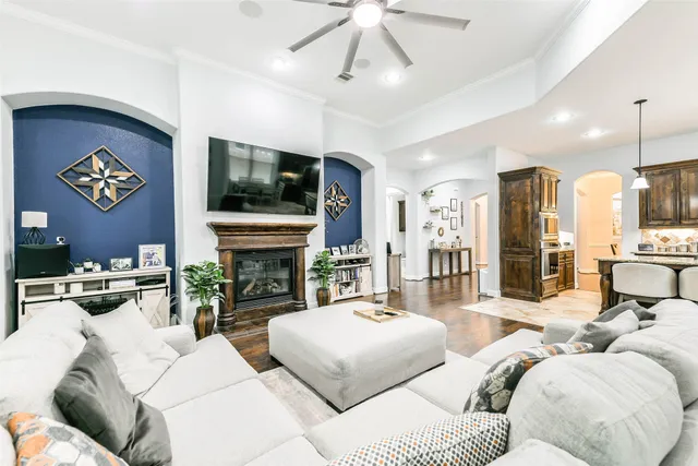 a living room with fireplace furniture and a flat screen tv