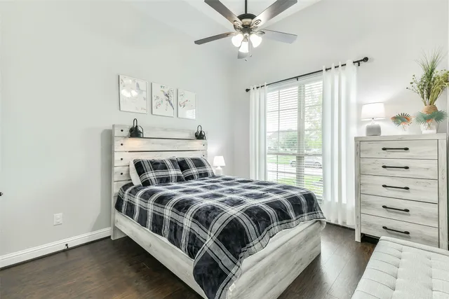 a bedroom with a bed and a dresser