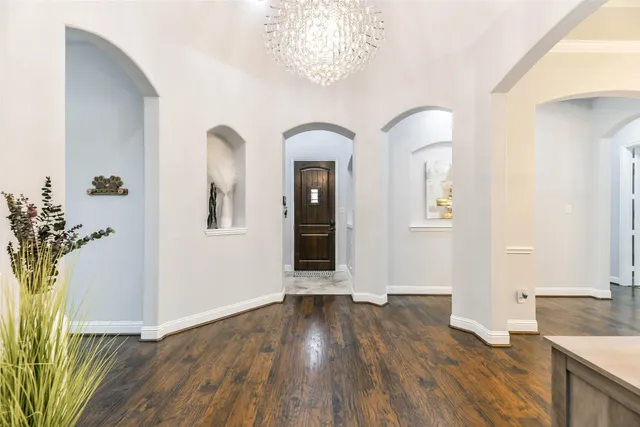 a view of an entryway with wooden floor