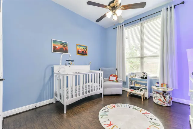 a bedroom with furniture and a window