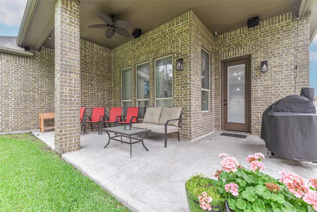 a view of a chairs and table in backyard of the house