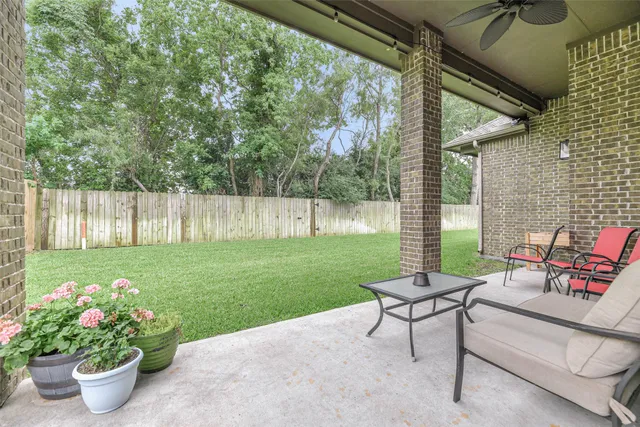 a backyard of a house with lots of green space