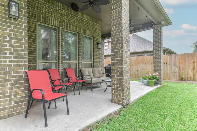 a view of backyard of house and garden