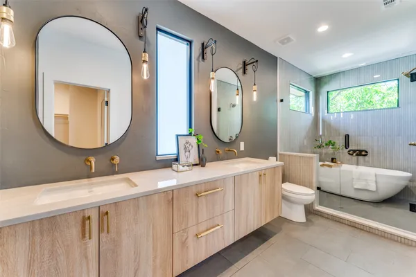 a bathroom with a toilet and a sink