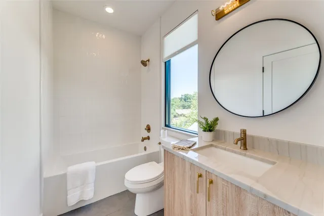 a bathroom with a toilet and a sink